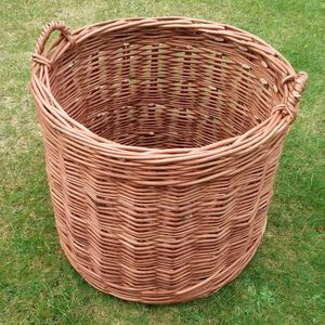Buff randed round log basket made in the thickest willow availible.