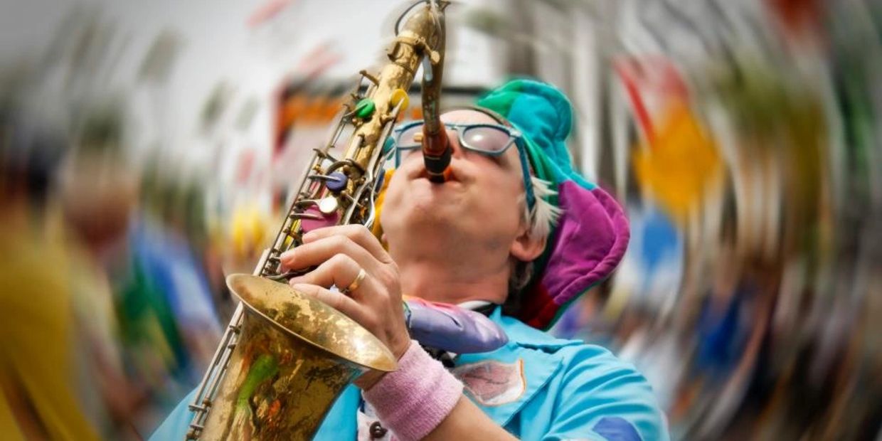 A colorful musician playing saxophone with a dizzy background effect.