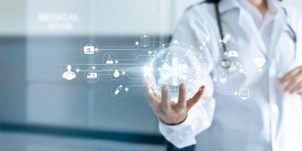 Doctor holding a digital medical network interface with healthcare icons.