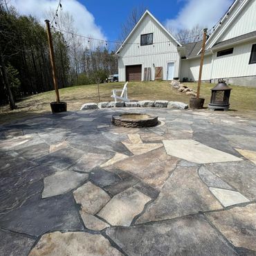 Drystack fire pit with random flagstone