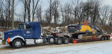 Semi with lowboy trailer