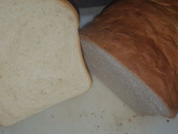 Loaf of white sandwich bread cut in half