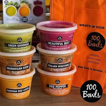 Stack of organic soups showcasing clear soup labels.