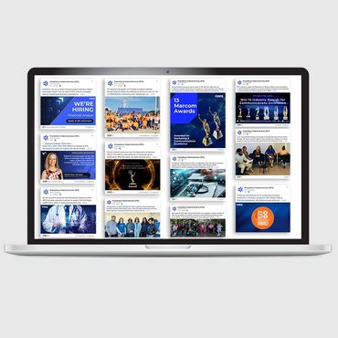 Laptop showing social media graphics