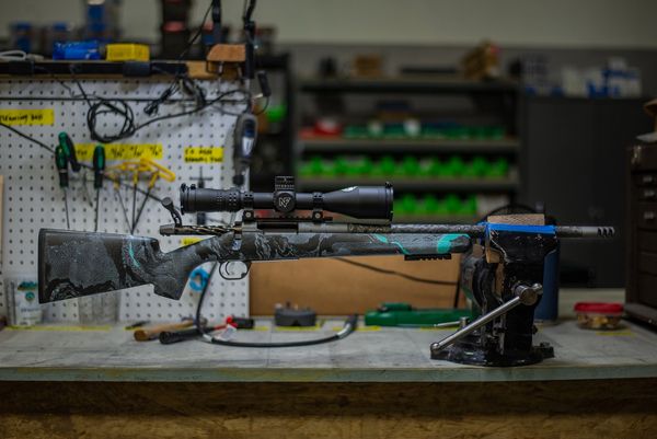 Custom Cerakote dip on carbon fiber rifle stock with Proof Research barrel and Night Force scope.
