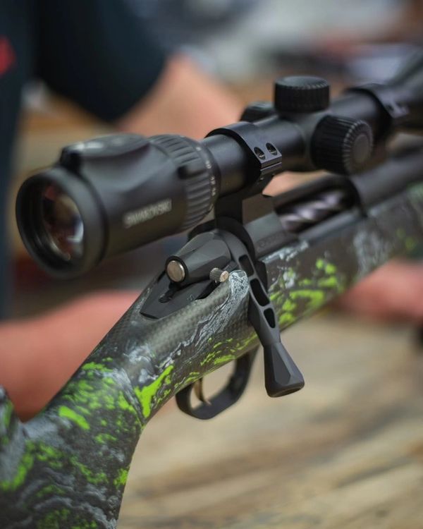 Custom cerakote dip carbon bolt action rifle stock with Swarovski scope.