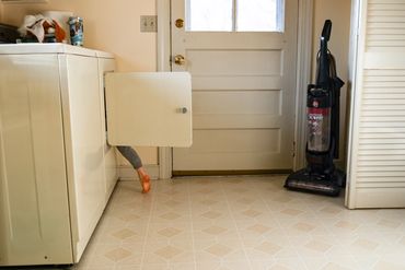 toddler climbing in dryer Nashville family photographer