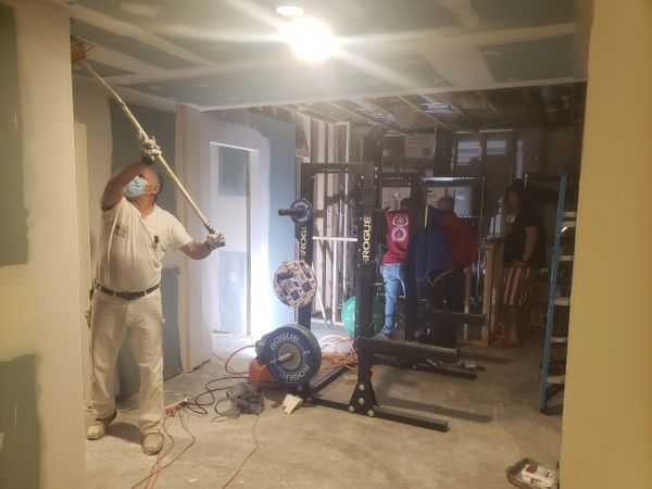Basement Remodel Progress Picture, Drywall and Electrical, Bar Plumbing being installed