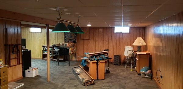 Basement Water Damage Repair, New Wall Panels, Commercial Grade Carpet