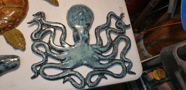 Octopus, high fired wall hanging.  Approximately 18 inches.