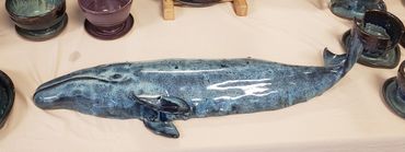 Gray whale wall hanging in ceramic.