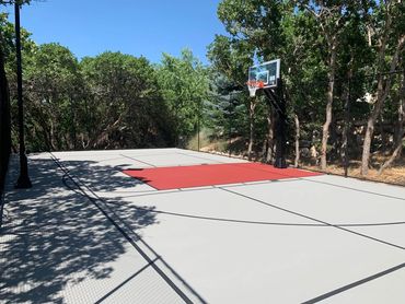 Basketball Court. Painted Basketball Court. Painted Multi Sport Court. Grey Backyard Court