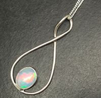 Ethiopian Welo opal oval pendant in solid Sterling Silver