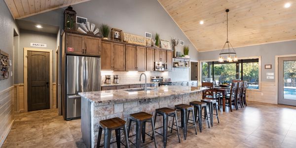 This is an image of the kitchen and dining area of the Chula Vista Lodge in Concan Texas.