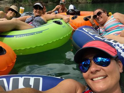 This is an image of friends floating on the Frio River.