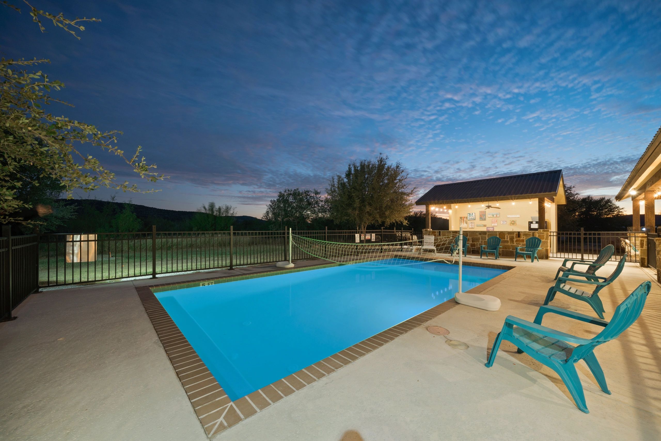 Night picture pool at Rustic Riviera Lodge in Concan, TX near the Frio River.