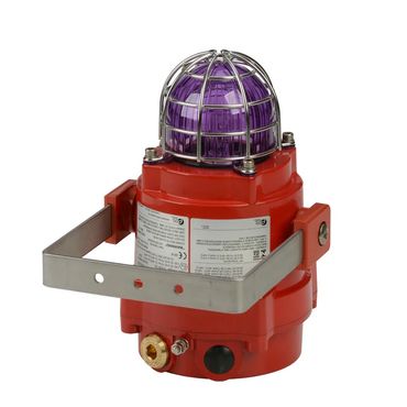 Red industrial warning light with purple dome and metal cage.