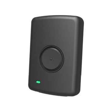 Compact black device with a circular button and a small green indicator light.