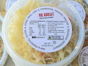 Plastic containers of BK Kraut traditional fermented sauerkraut with labels.