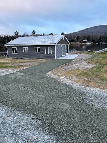Gravel Driveway and paver patio by Four Seasons Landscaping