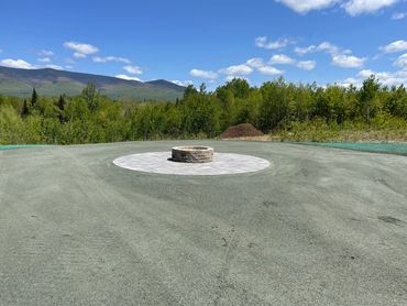 Firepit and new parking area installed by Four Seasons Landscaping with a view of the White Mountains