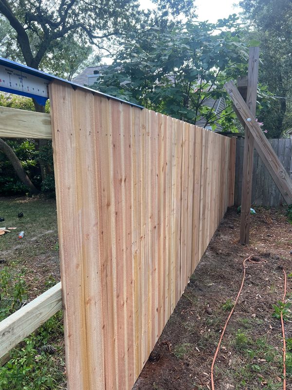 Custom wood privacy fence installation in Hampton Roads VA backyard