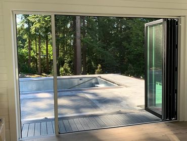 Horizon Retractable screen with captured edge is the choice for this 16' opening. No screen blowouts