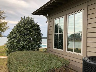 Lake home windows blocking maximum heat gain with UV Sun glare inside. SPF Tinting in Eclectic, AL