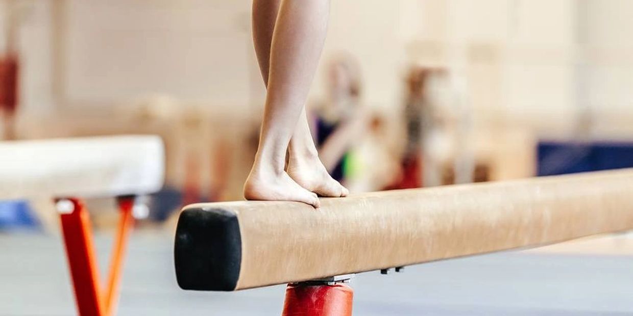 Kid on the balance beam