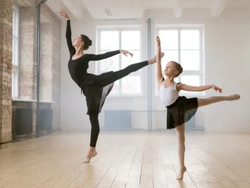 Teacher and student doing ballet