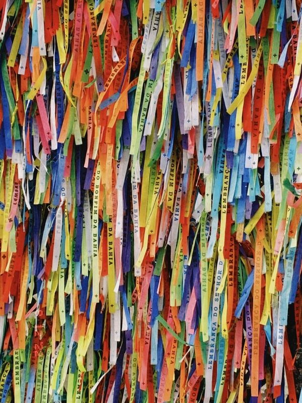 Colorful ribbons with inscriptions hanging closely together.