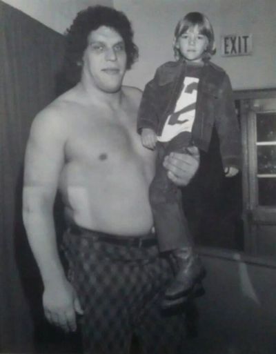 The author as a young boy held by Andre the Giant