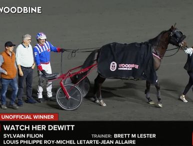 Winning horse Watch Her Dewitt at Woodbine with jockey and team.
