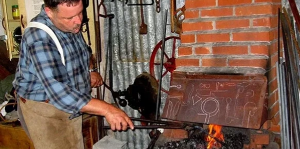 blacksmith working at forge