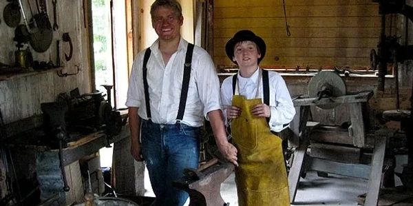 blacksmith with young apprentice