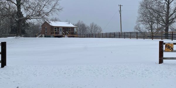 Airbnb cabin covered with snow