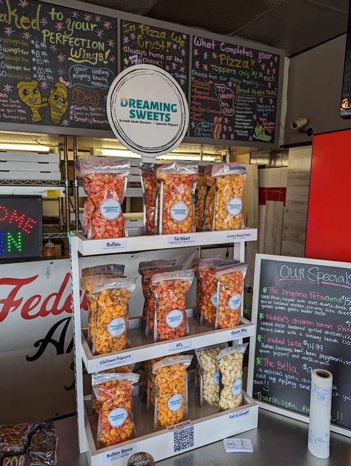 Display of Dreaming Sweets popcorn varieties in a store.