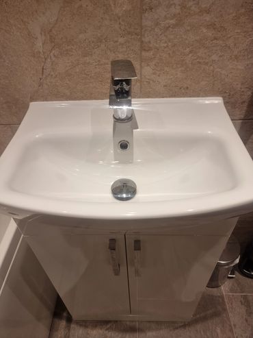 New basin waste and cabinet installed