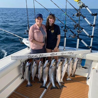 Mother and daughter enjoying Lake Michigan Charter fishing trip with King Salmon and Coho Salmon