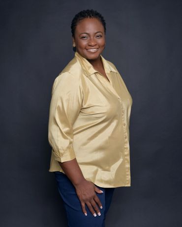 Canangela is standing and showing her stature as a model, actress, and voice talent.