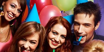 A lively party at Extreme Go-Kart Racing in Clio, Michigan, with guests gearing up to race go karts and enjoy junior and K1 kart racing.