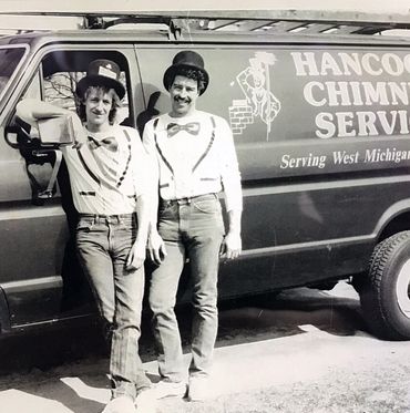 Chimney Sweeps in front of a service truck