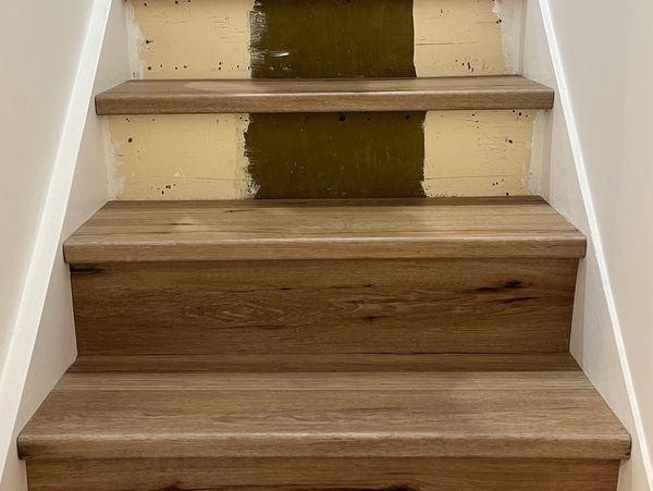 Stairs being covered in oak stair cladding