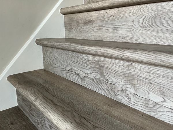wood-look stair covering with a round front