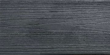 Close-up of black textured wooden surface.