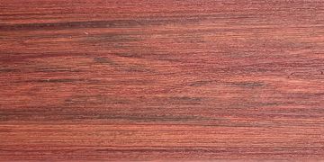 Close-up of reddish wood grain texture.