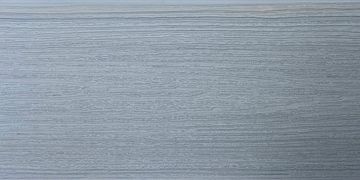Close-up of textured grey wood surface.
