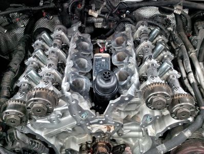 Engine block with header removed to expose timing chain gears.