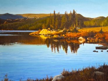 Lake surrounded by autumn trees.