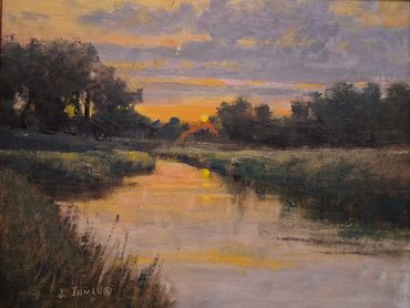 Sunset over a calm river.